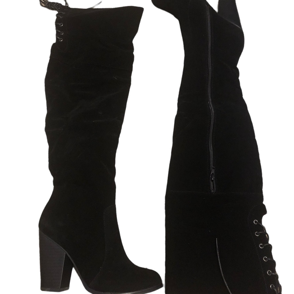 Black thigh high boots.